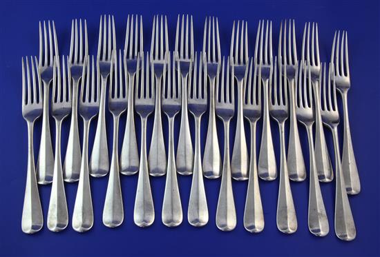 A set of twenty four Victorian silver Hanovarian pattern table forks, 58 oz.